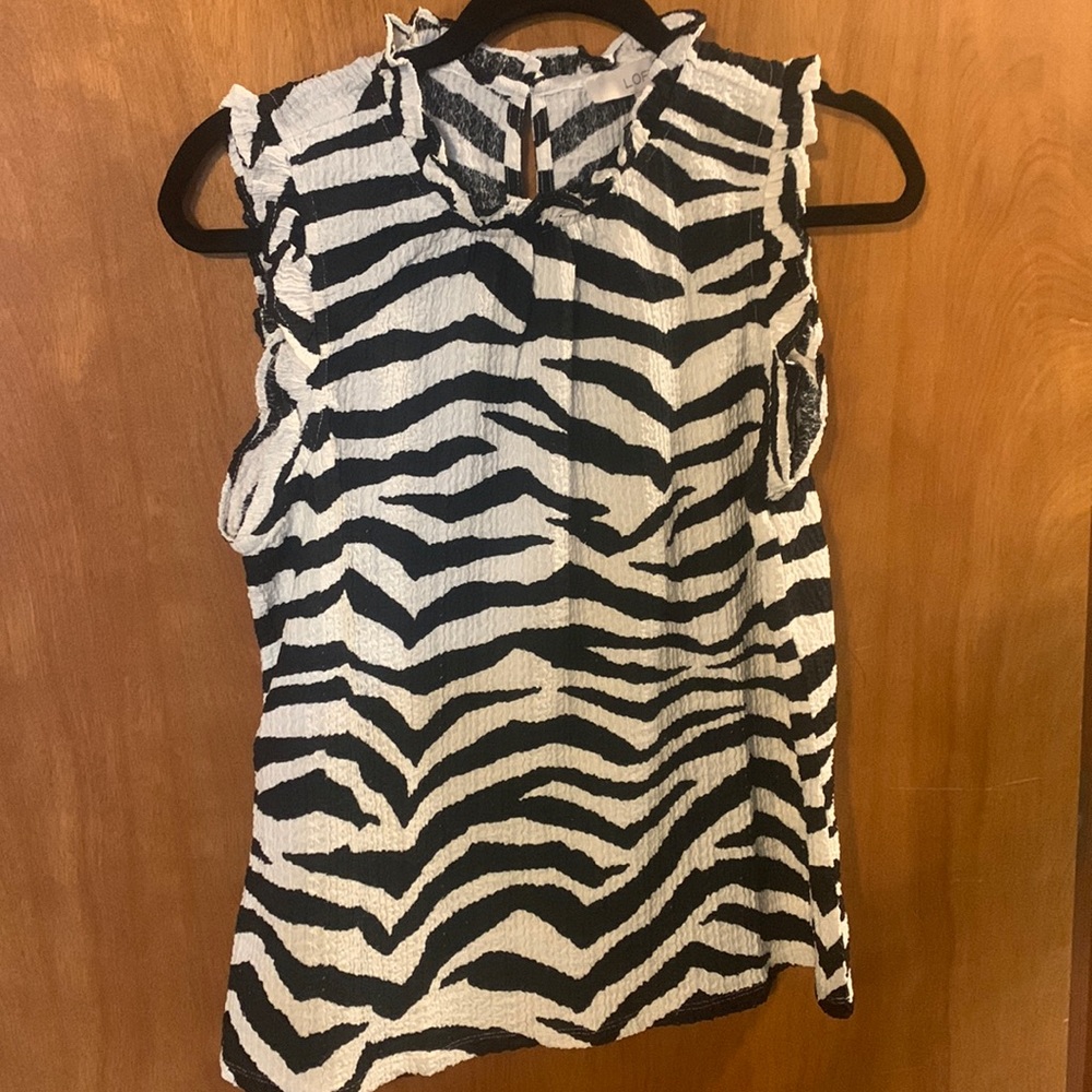 NWTBlack/white zebra print sleeveless blouse with ruffle trim neck and sleeve